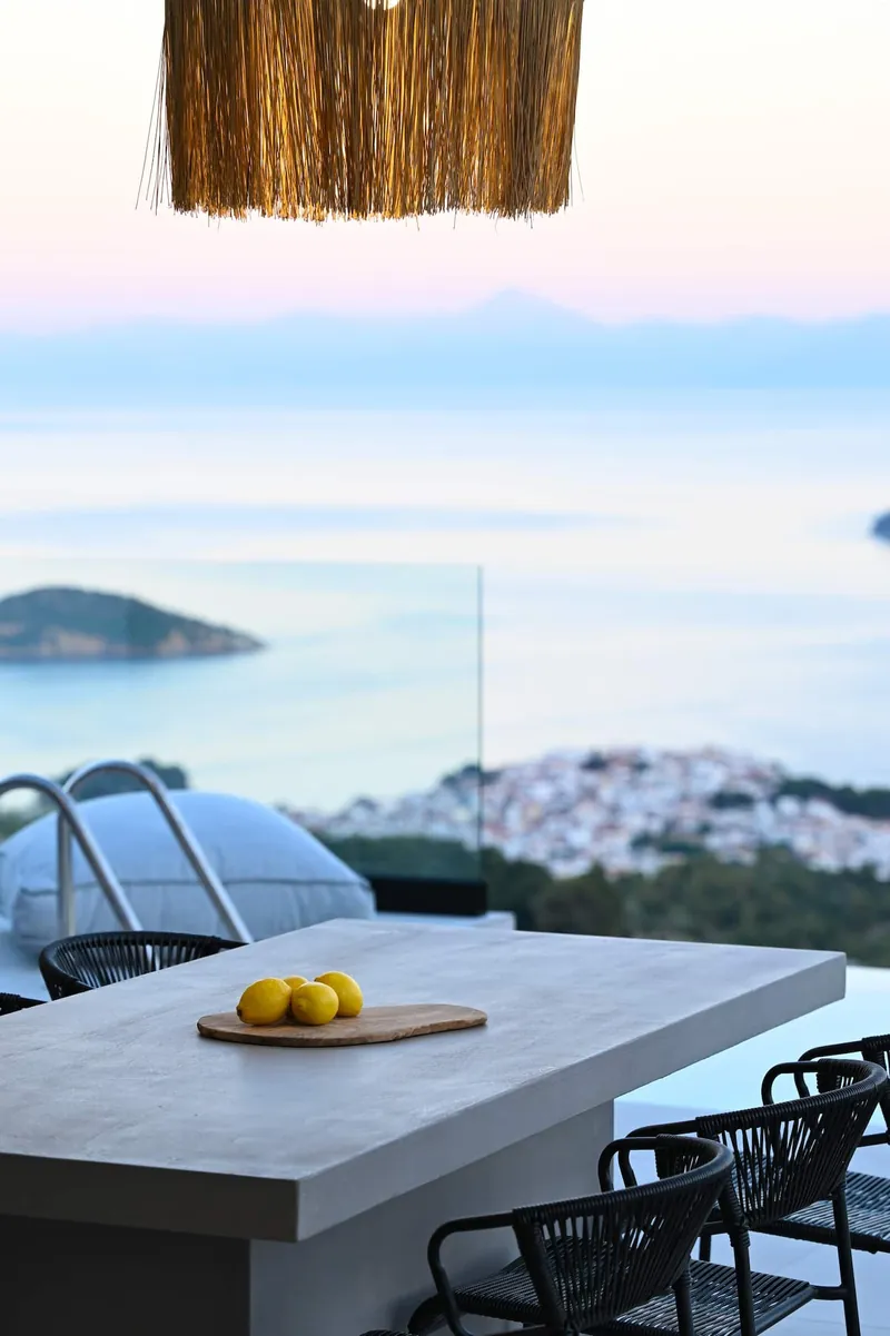 Lemons on the terrace bar at dusk, above the town and the sea
