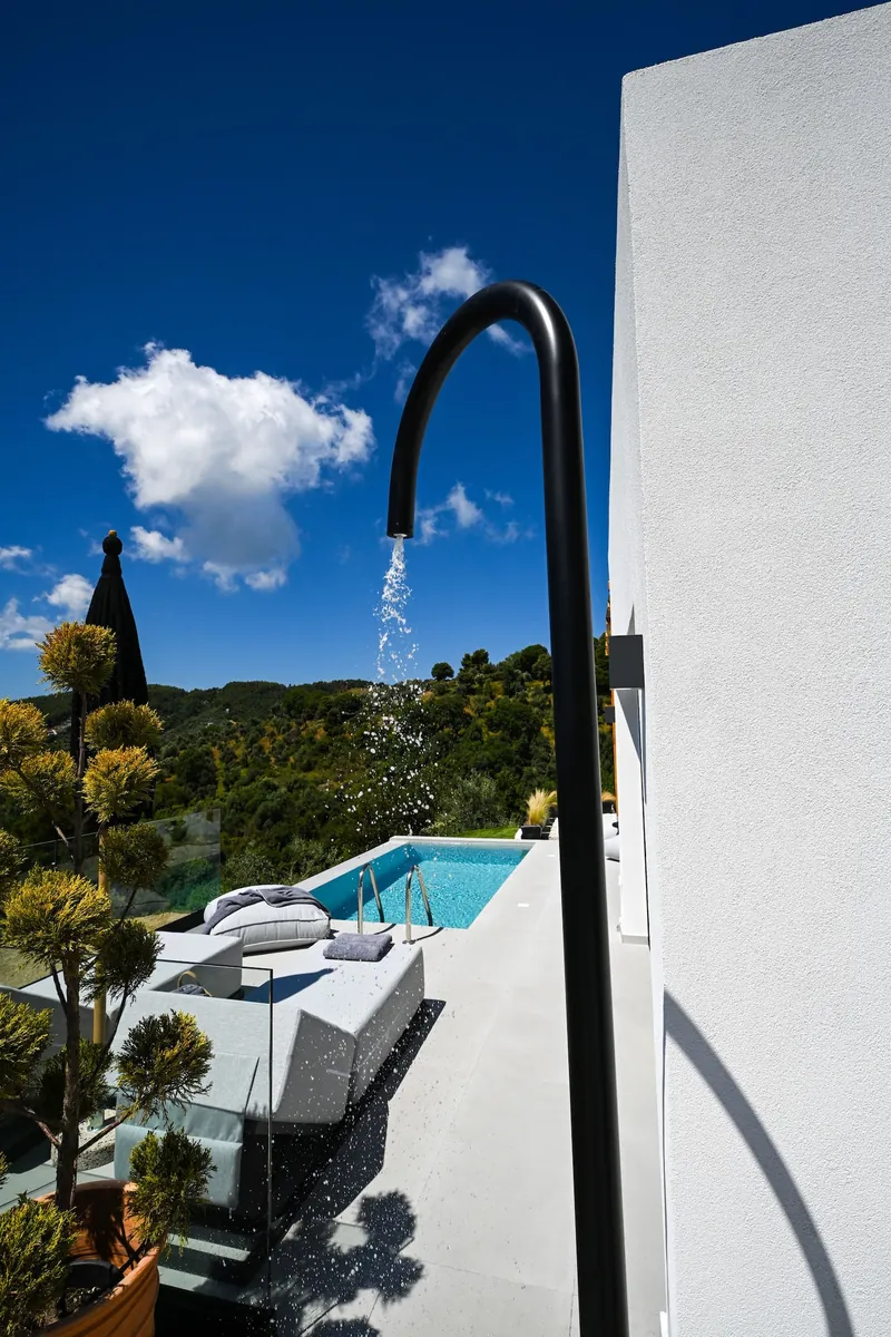 The outdoor shower beside the pool